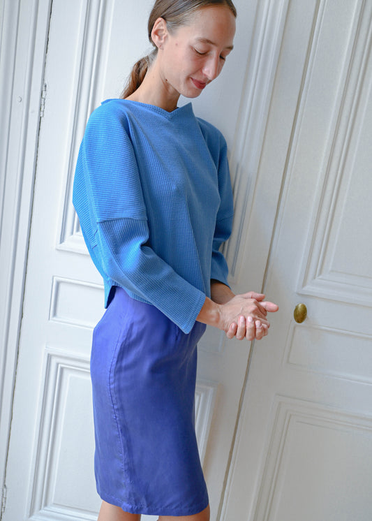 Three quarter view of the TURN Paris Blue Heart Shape sweater, oversized rounded sleeves and cropped hem