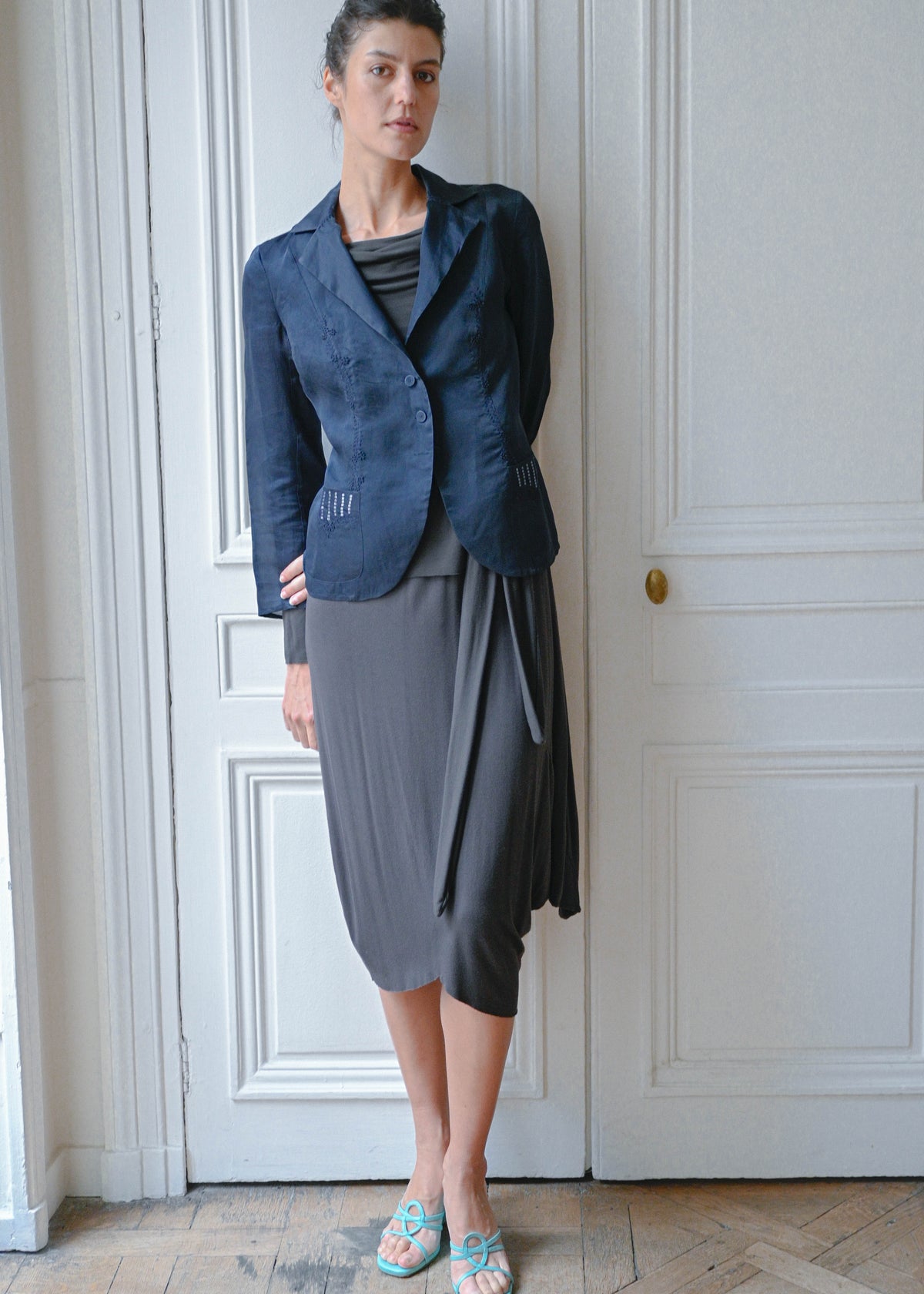 Vintage navy embroidered silk blazer with sequins, front view, worn with a grey draped skirt, TURN Paris