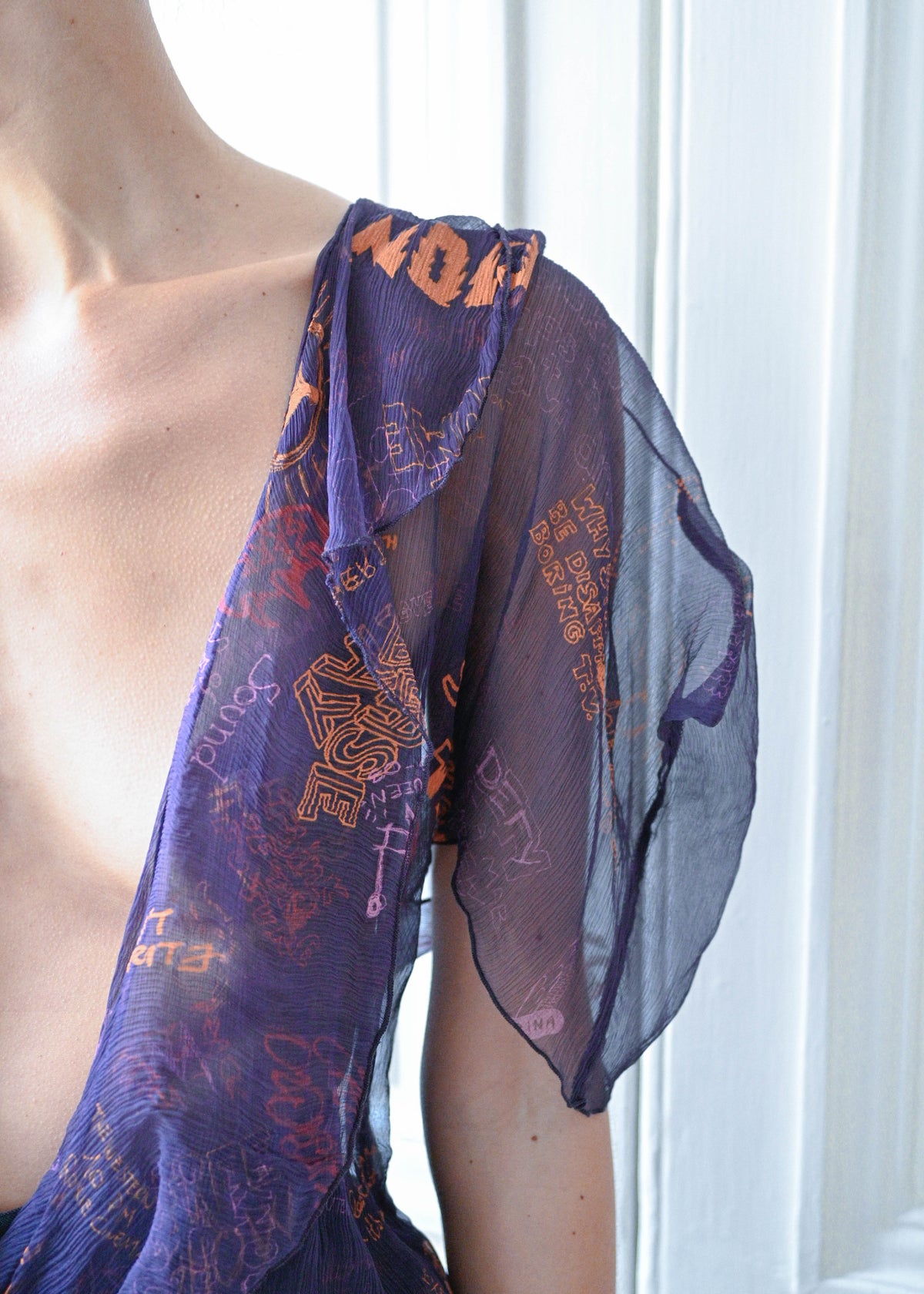 Vintage purple printed silk blouse, close-up of the sheer sleeve, TURN Paris