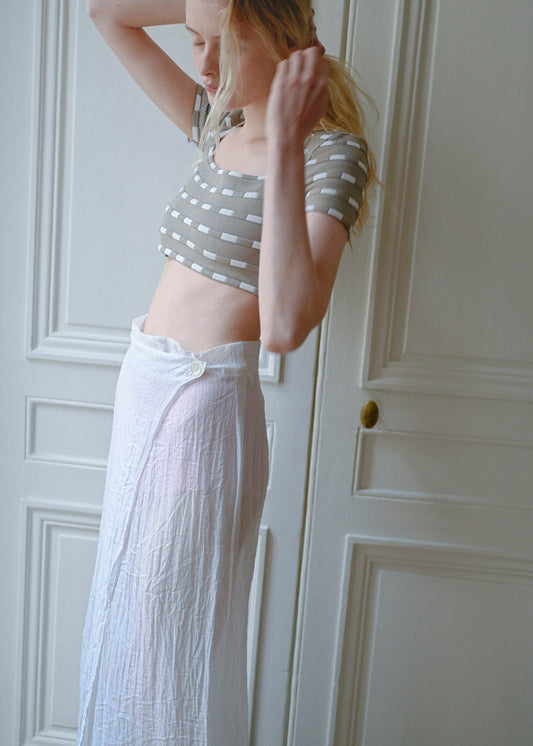 Vintage white sheer maxi wrap skirt, worn with a cropped knit top, close up, TURN Paris