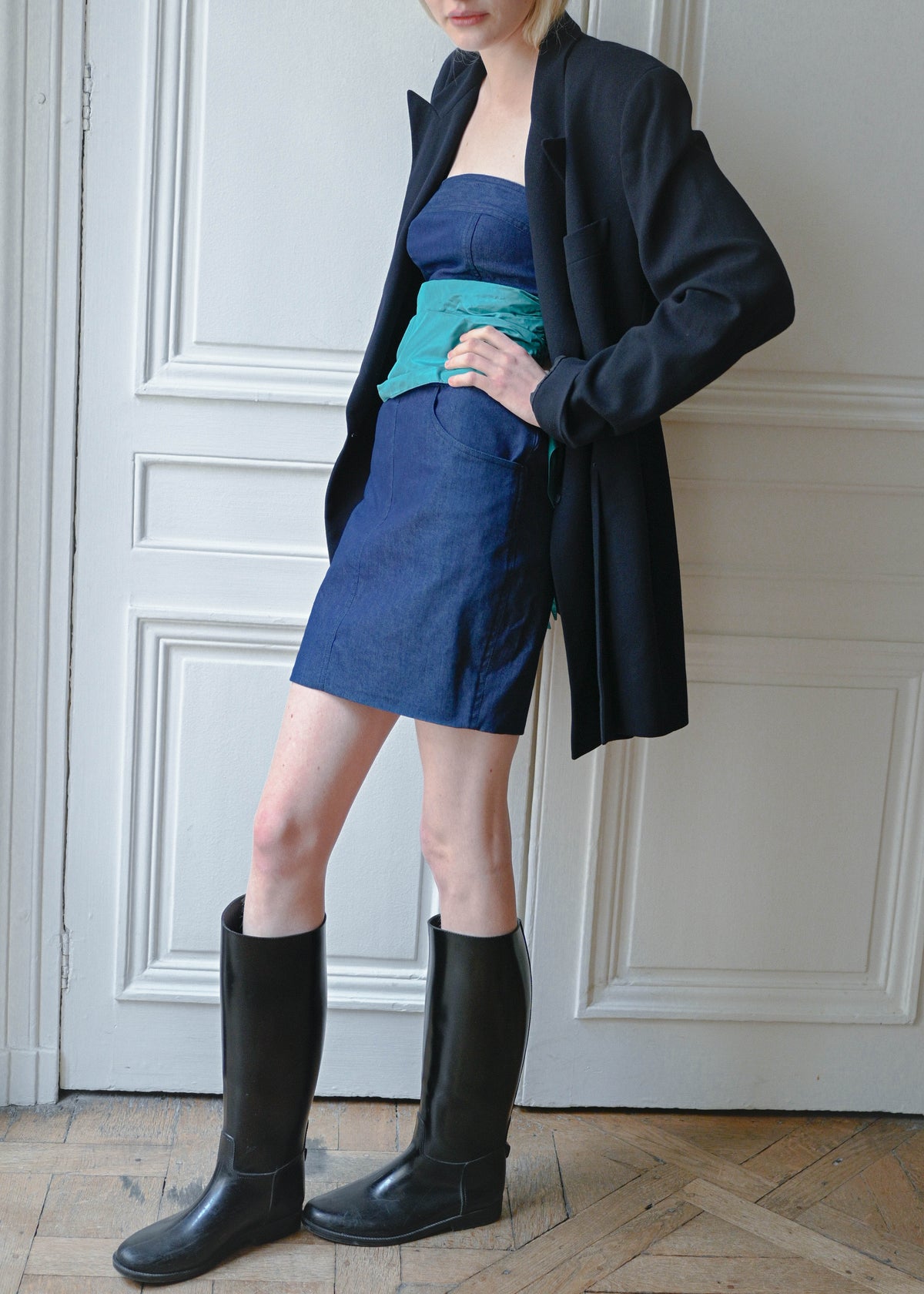 Vintage navy oversized jacket worn over a strapless denim dress, side view, TURN Paris