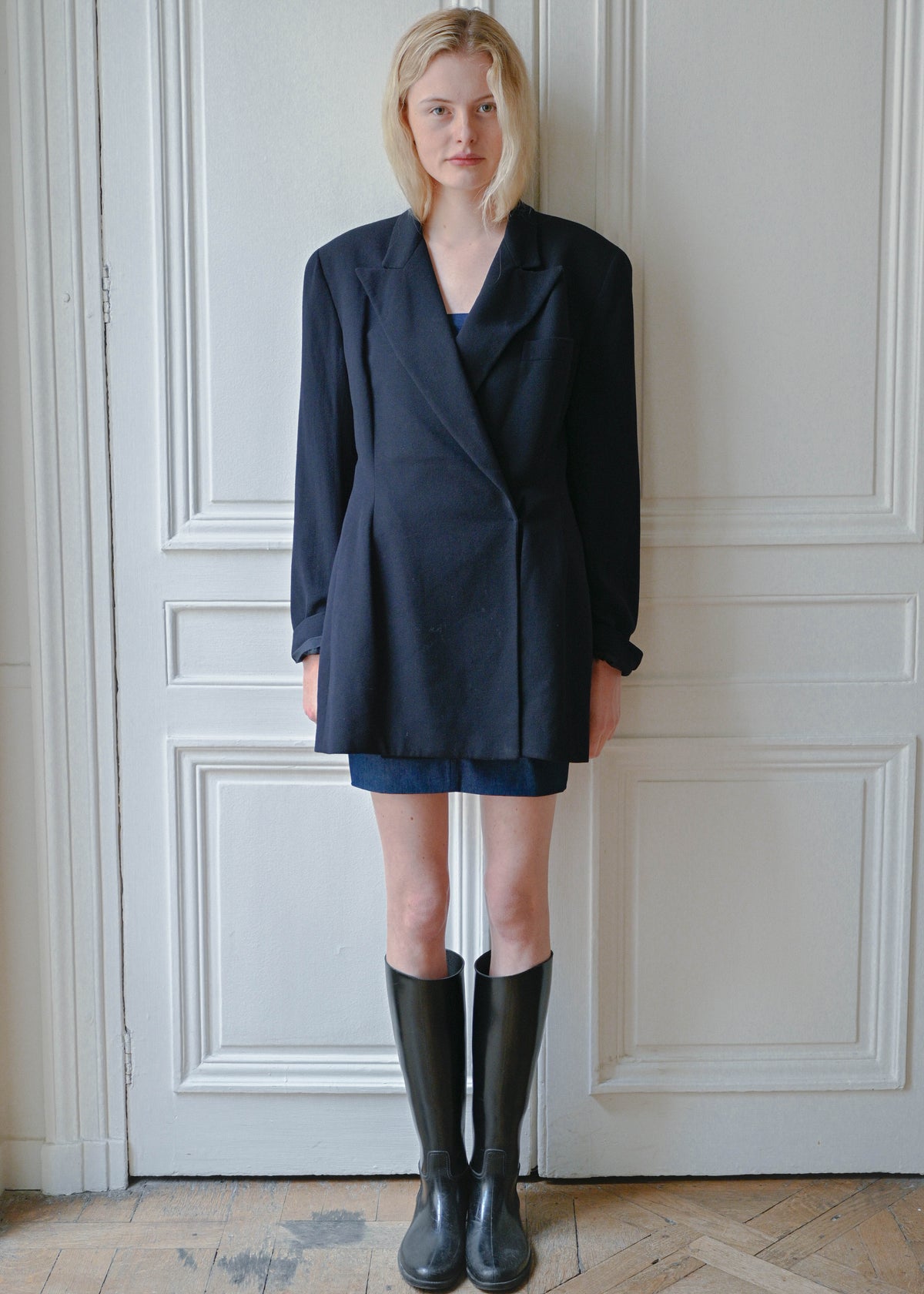 Vintage navy oversized jacket worn over a strapless denim dress, front view, TURN Paris