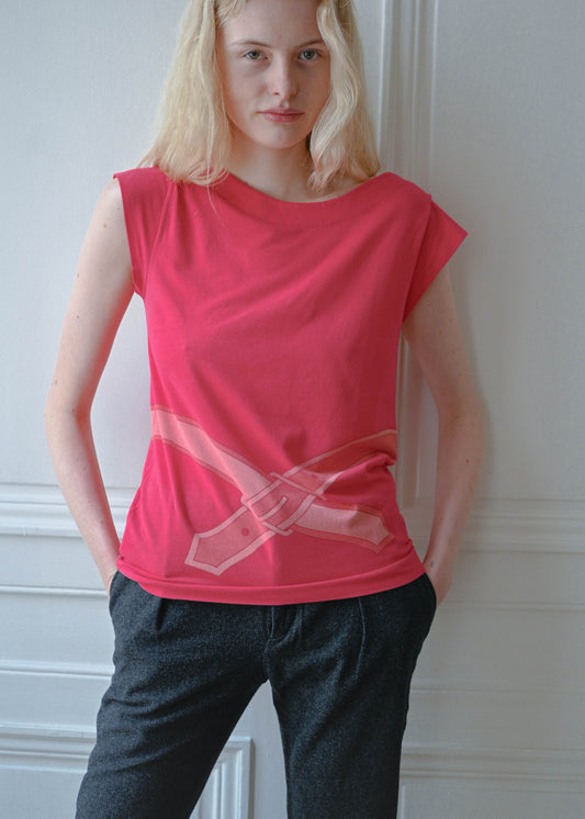 Vintage red sleeveless top with a trompe l'oeil belt print, worn with grey wool trousers, front view, TURN Paris