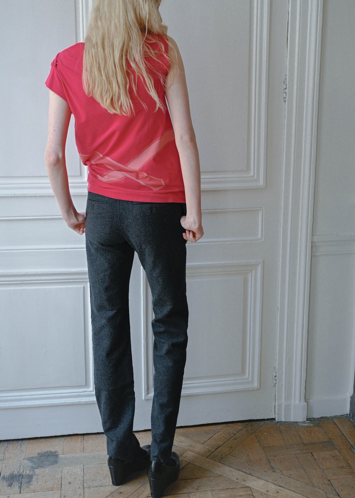 Vintage Celine grey wool trousers, worn with a red sleeveless top, close up, TURN Paris