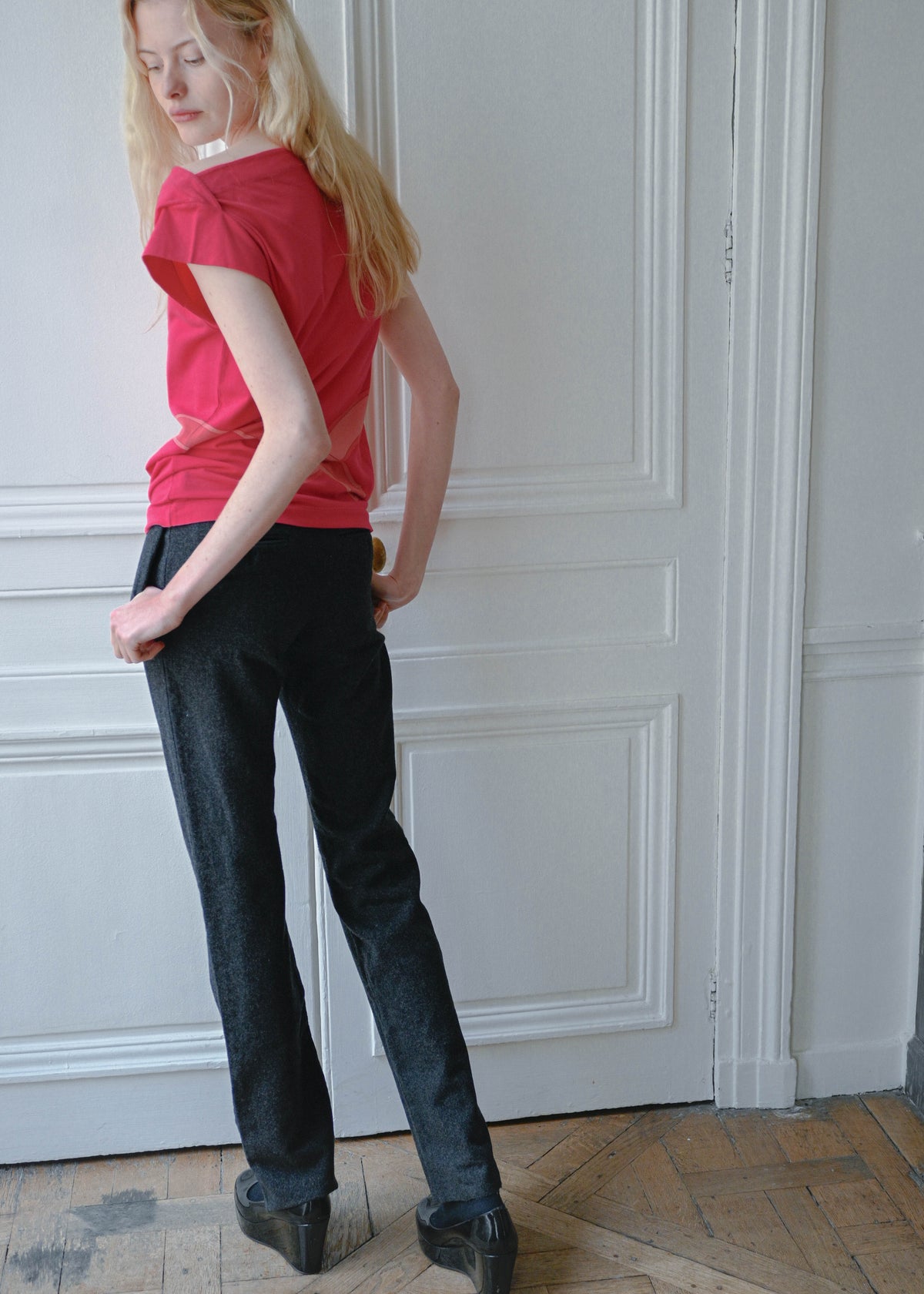 Vintage Celine grey wool trousers, worn with a red sleeveless top, back view, TURN Paris