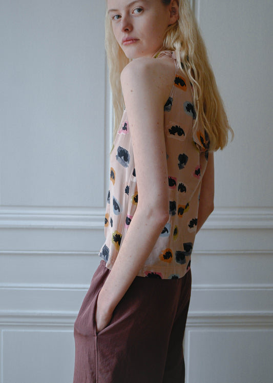 Vintage Moschino sleeveless top with an eyes print, worn with the TURN Loose Pant in burgundy, back view, TURN Paris