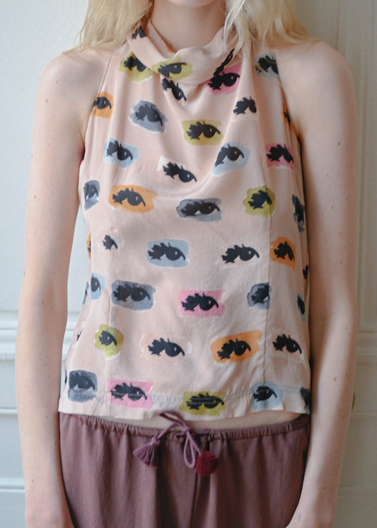 Vintage Moschino sleeveless top with an eyes print, worn with the TURN Loose Pant in burgundy, front view, TURN Paris