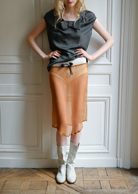 TURN Paris midi skirt in bronze silk crepe, tied at the waist with a custom-made asymmetrical pompon made in France. 100% silk.