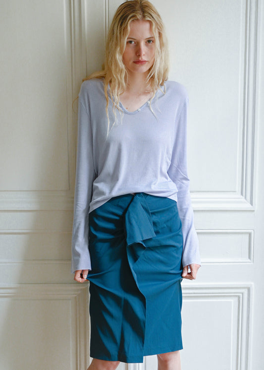 TURN Paris Tunisien-style top in lavender with long sleeves, made of Japanese lyocell, silk and wool blend with pearl buttoning.