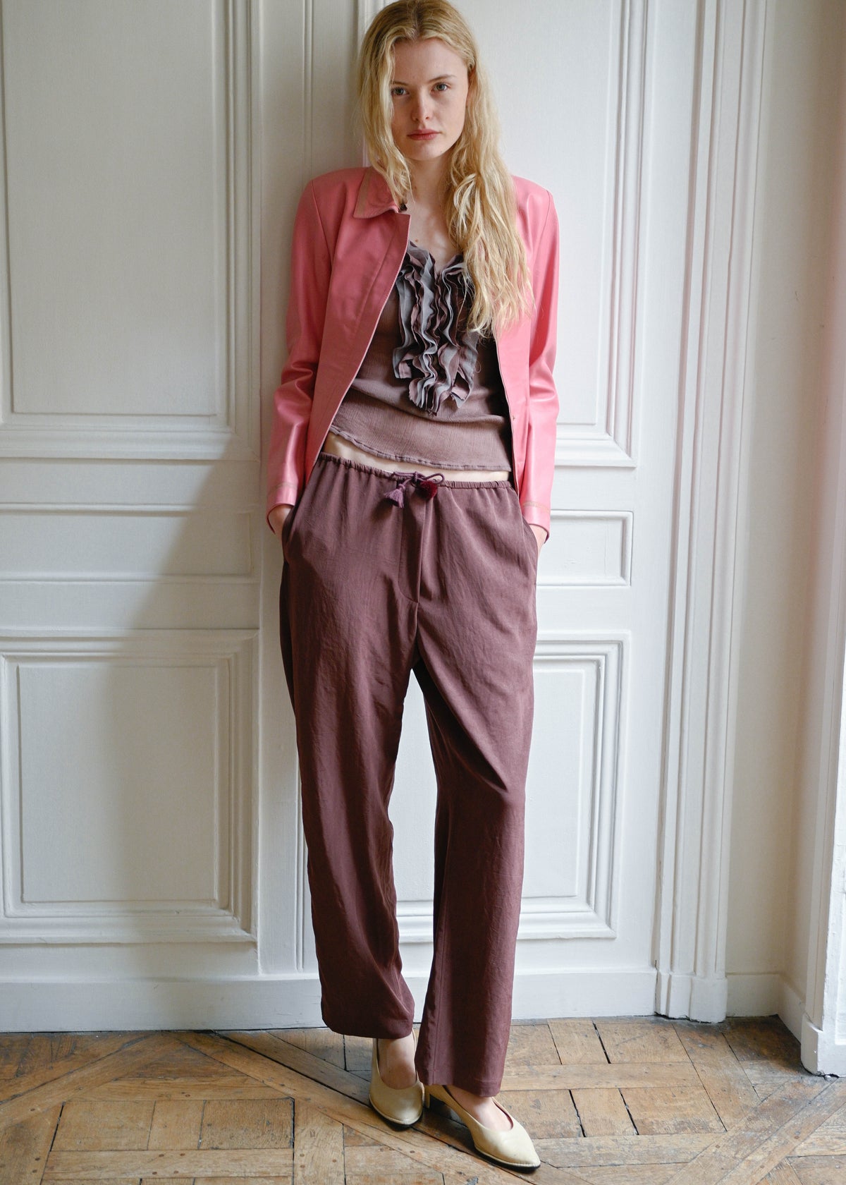 TURN Paris flowy loose pant in burgundy, tied at the waist with a custom-made asymmetrical pompon made in France.