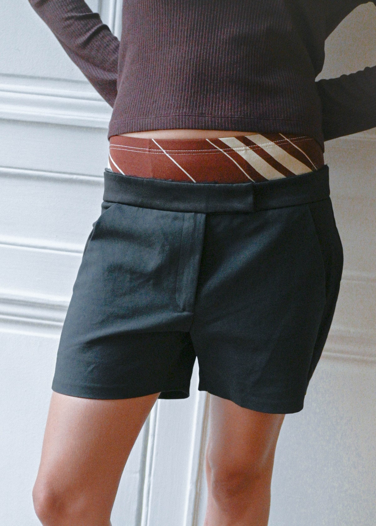 Black silk shorts, close-up