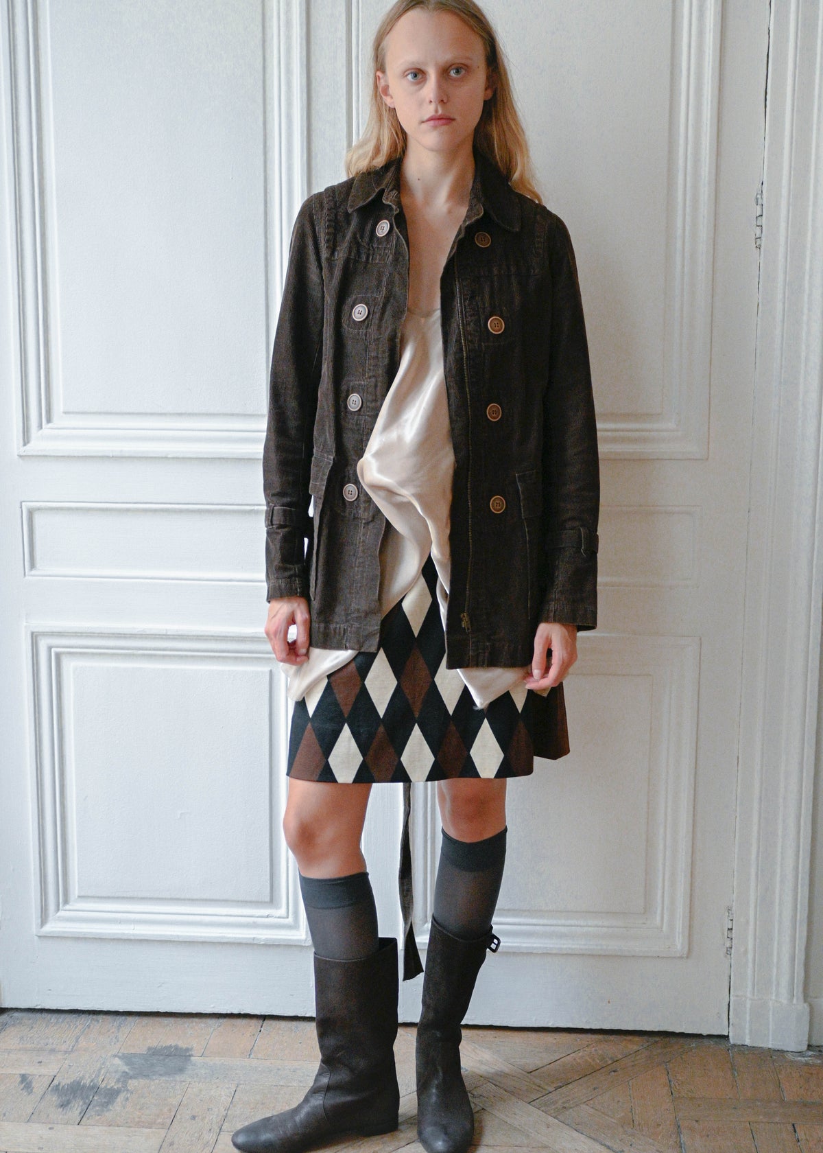 Brown velvet safari jacket worn with diagonal check wool skirt, front view