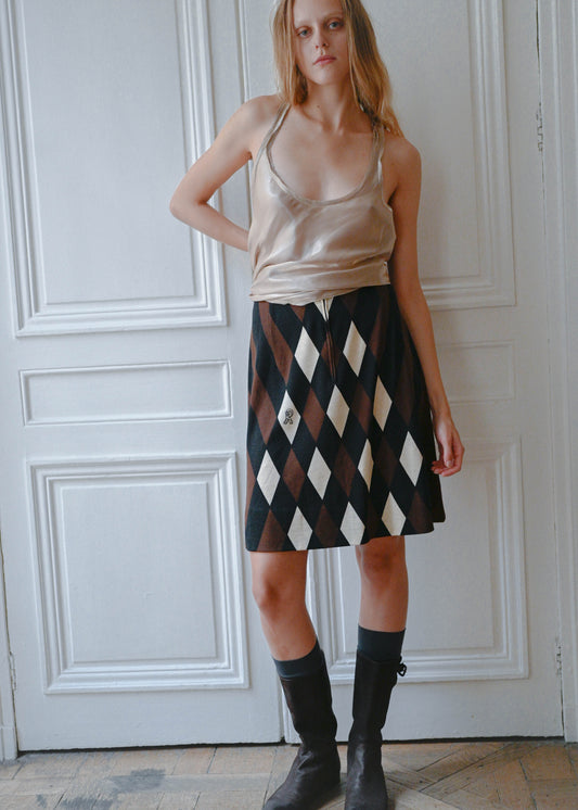 Diagonal check wool skirt worn with the TURN Hue Tunique, front view