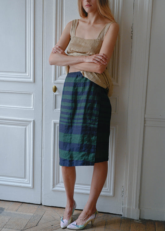 Striped linen skirt worn with gold textured mini dress, front view