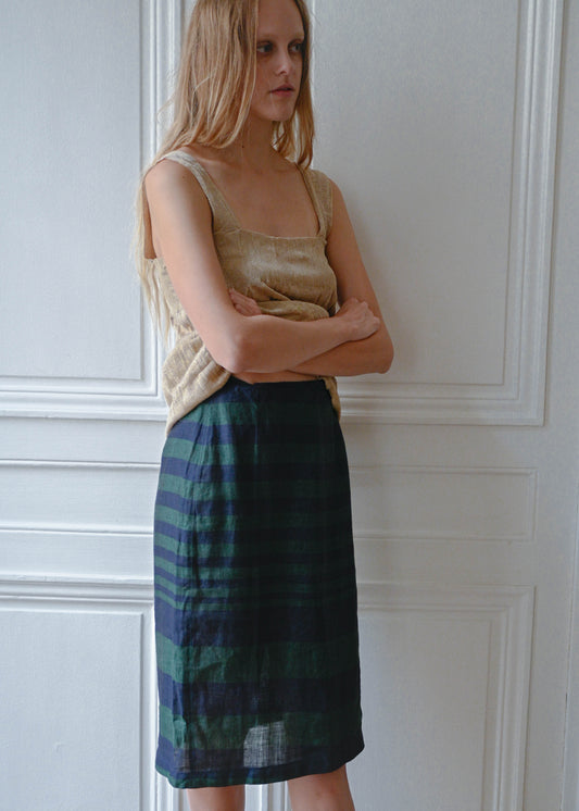 Striped linen skirt worn with gold textured mini dress, front view