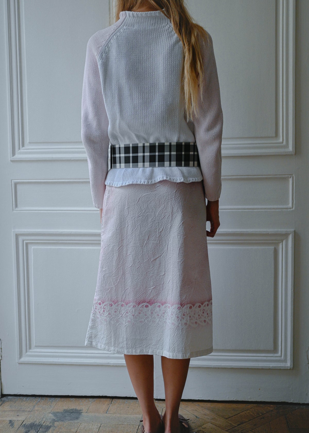 Crinkled print midi skirt worn with pink and white knit sweater, front view