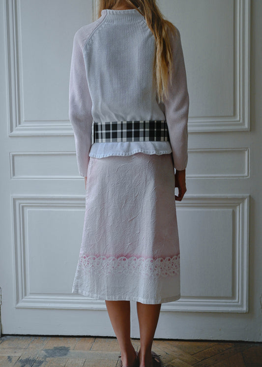 Crinkled print midi skirt worn with pink and white knit sweater, front view