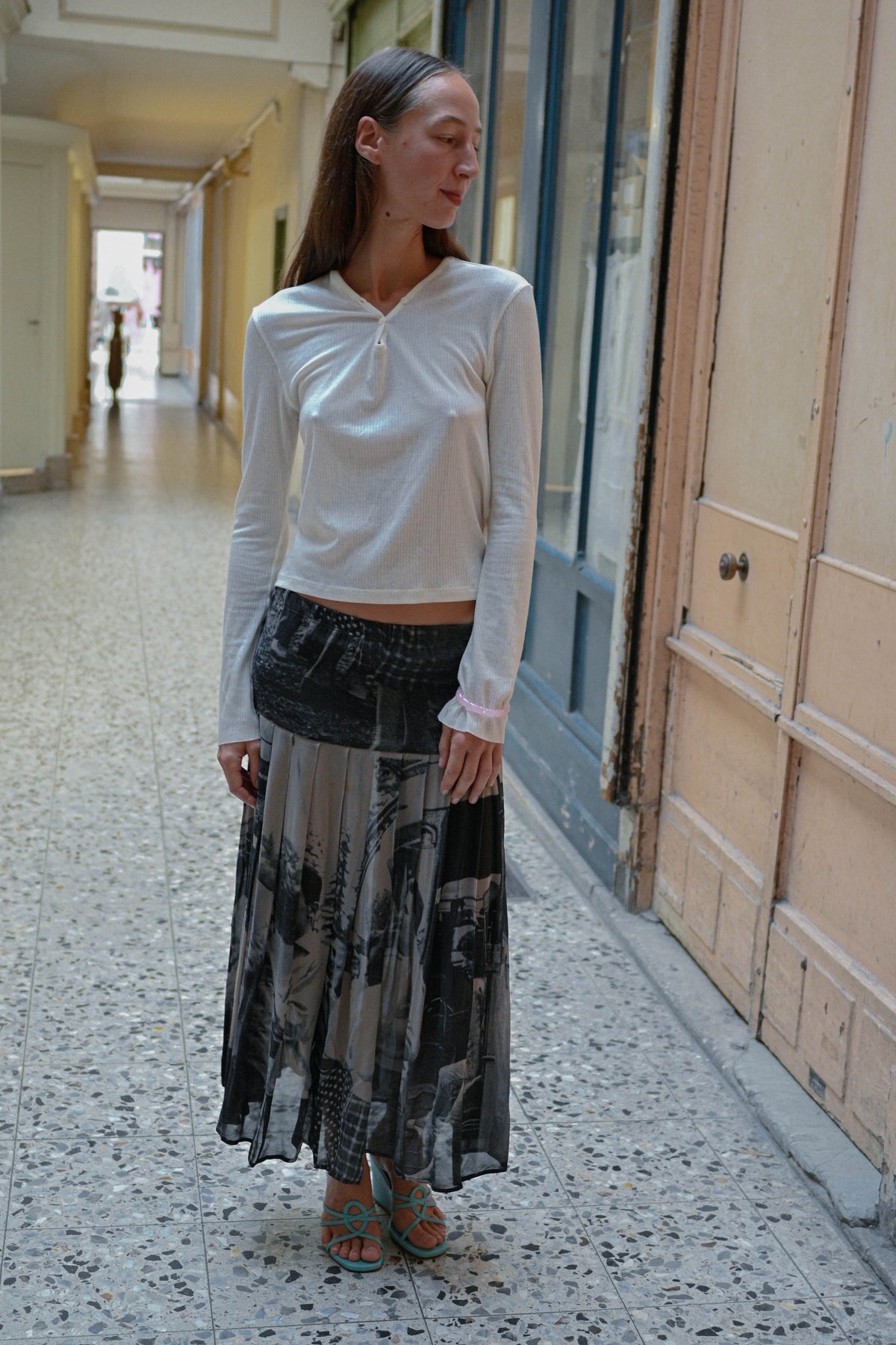 Photo print pleated maxi skirt worn with the TURN Tunisien top in white, front view