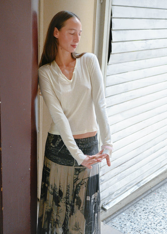 TURN Paris White Tunisien Top styled with a black and white printed maxi skirt, three quarter view