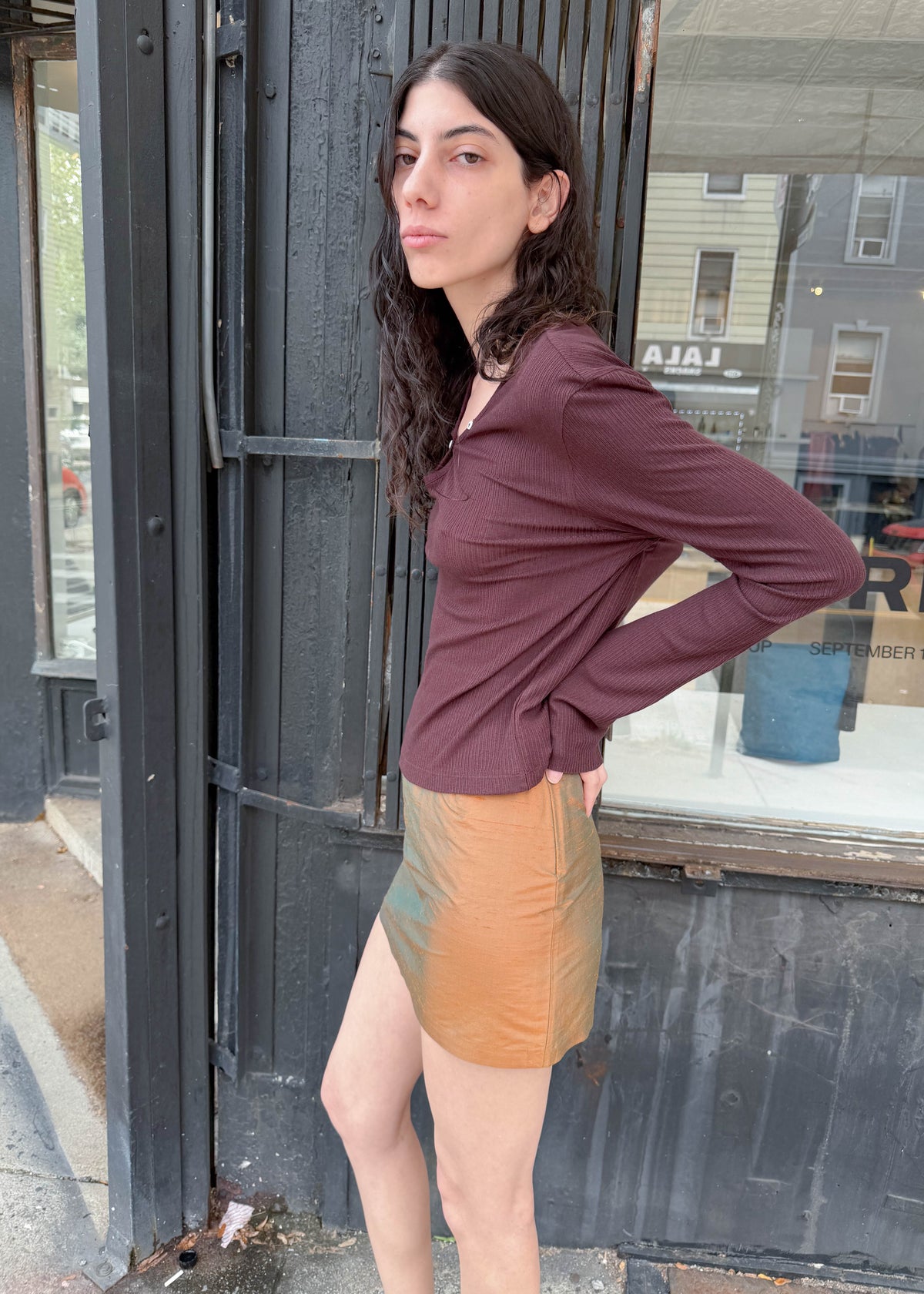 TURN Paris Tunisien-style top in brown with long sleeves, pearl buttoning and a cinched, structured silhouette.