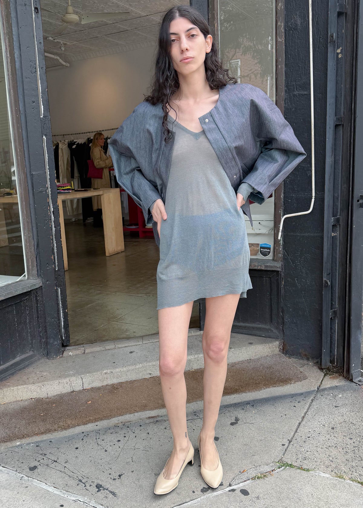 TURN Paris bomber jacket in glazed Japanese denim, cut in a boxy silhouette with rounded sleeves and slanted pockets, designed to enhance posture and subtly reveal the lower back.