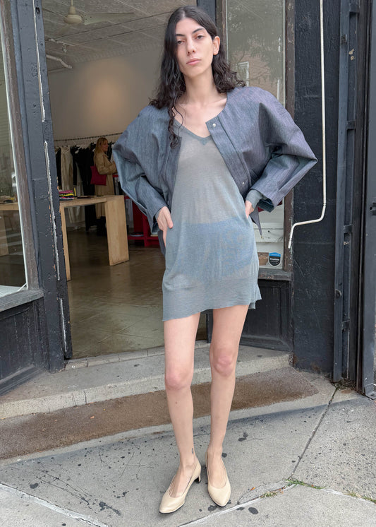 TURN Paris bomber jacket in glazed Japanese denim, cut in a boxy silhouette with rounded sleeves and slanted pockets, designed to enhance posture and subtly reveal the lower back.