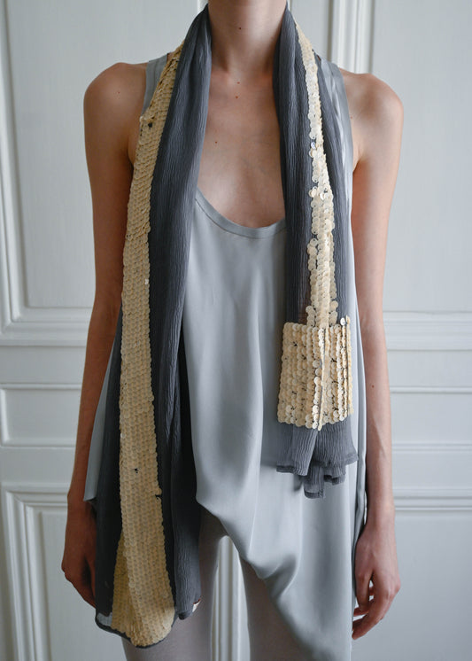 Grey silk crepe scarf with beige sequin T by TURN Paris, worn loose at the neck