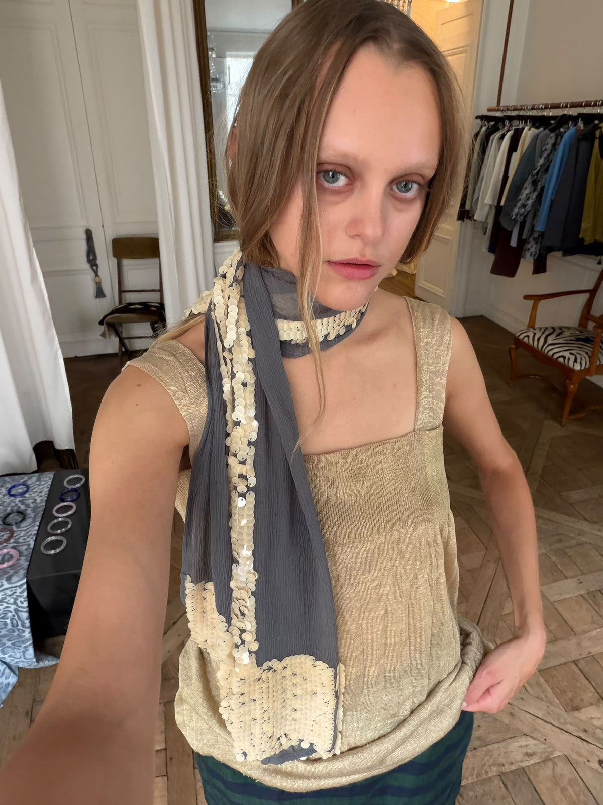 Grey T Scarf by TURN Paris worn long over a silk top, sequin T catching the light